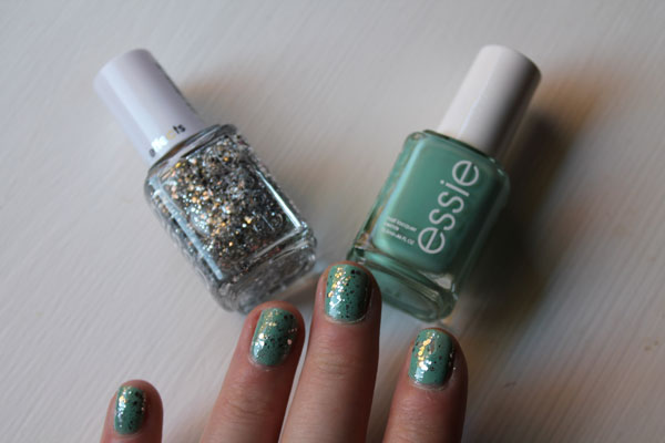 Turquoise nail polish with a silver sparkle top coat. 